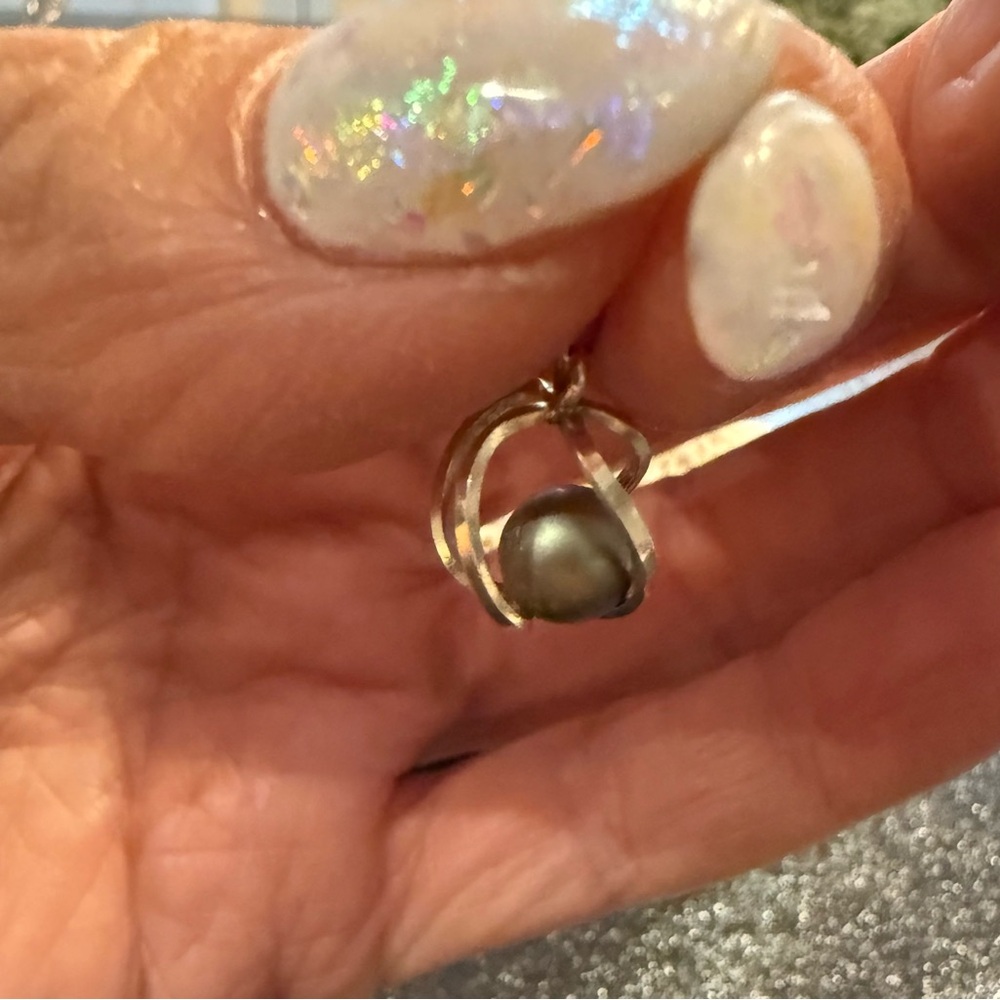 Genuine Gray Pearl Charm in a Sterling Silver Swirled Cage.